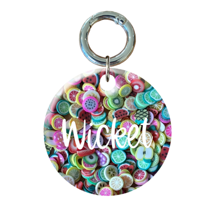 Colorful circular Pet ID tag with white text