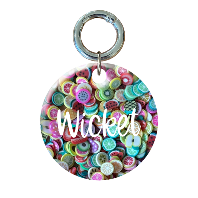 Colorful circular Pet ID tag with white text