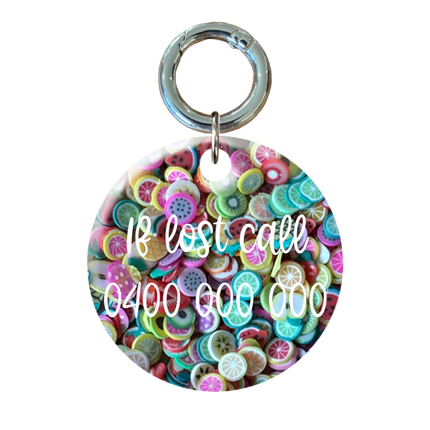 Fruit filled circle tag with contact information on he back.