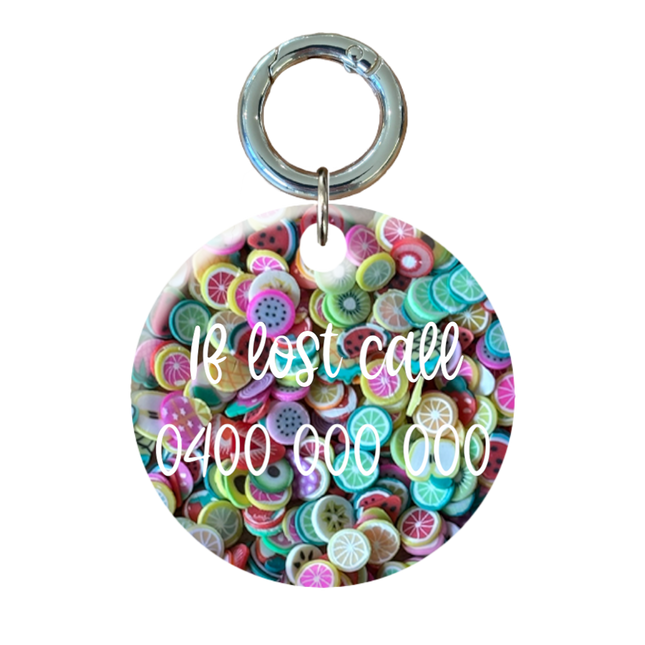 Fruit filled circle tag with contact information on he back.